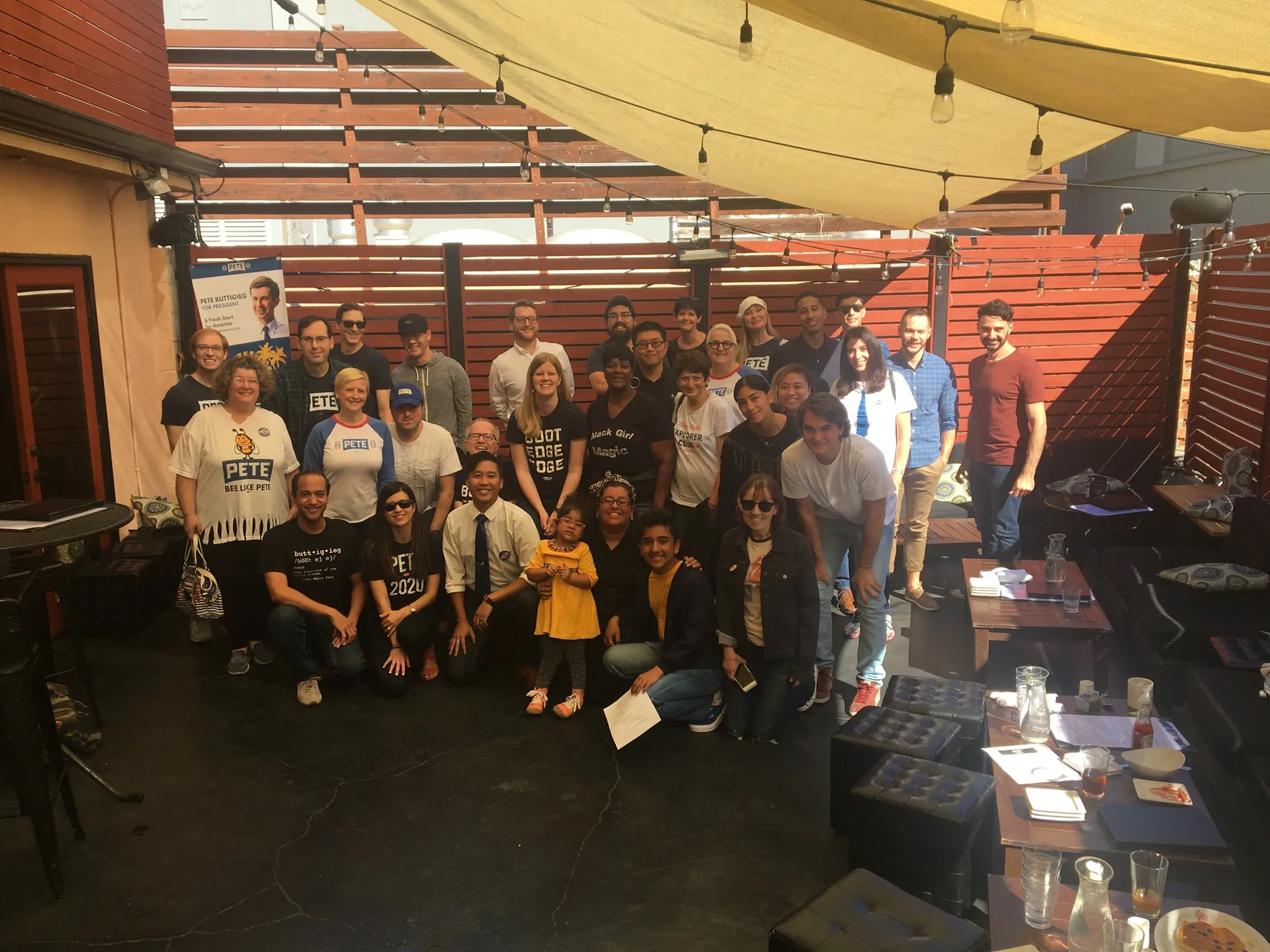 Volunteers gather in a room for a grassroots organizing meeting