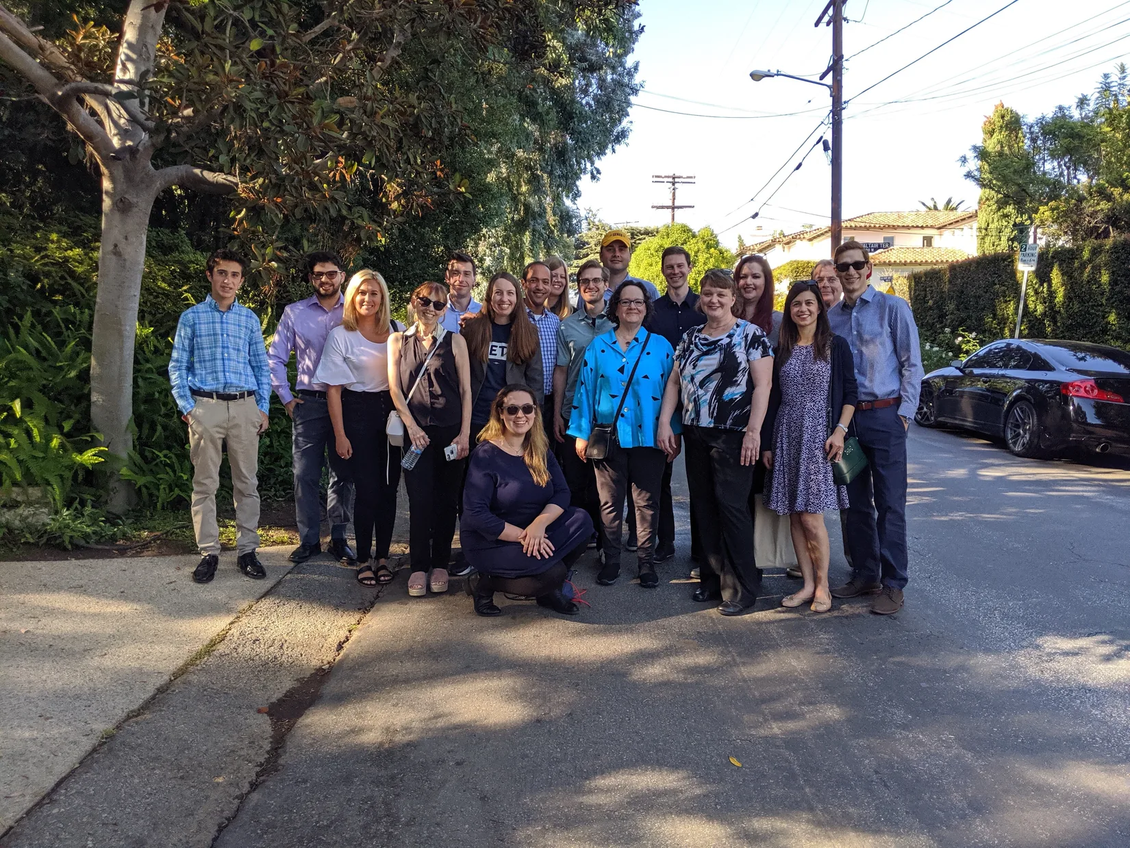 Campaign supporters posing together outside at a fundraising event